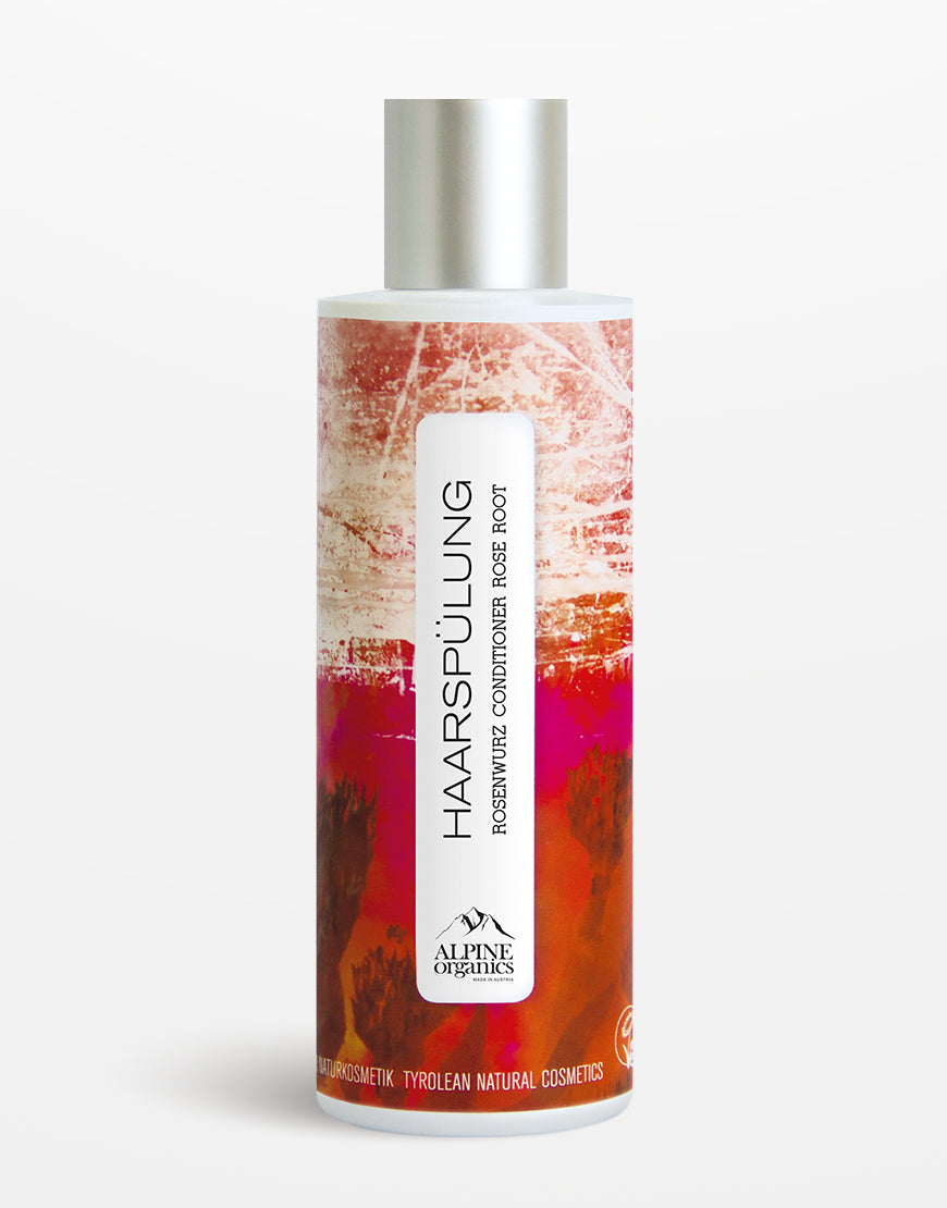 Zylinderflasche mit Haarspülung Rosenwurz von Alpine Organics, angereichert mit Rosenwasser und Haselnussöl, für glänzendes, geschmeidiges Haar. 100 % vegan, tierversuchsfrei.