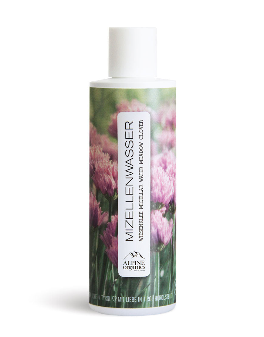 Mizellenwasser mit Wiesenklee & Aloe für sanfte Reinigung & Erfrischung: Zylindrische Flasche mit pinken Klee-Blumen auf Etikett, von Alpine Organics, für empfindliche Haut.