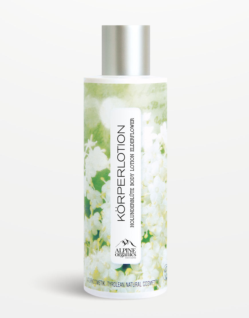 Körperlotion Holunder für zarte & geschmeidige Haut: Zylindrische Flasche mit silbernem Deckel, florales Etikett, angereichert mit biologischem Holunderblütenextrakt, vegan und tierversuchsfrei.