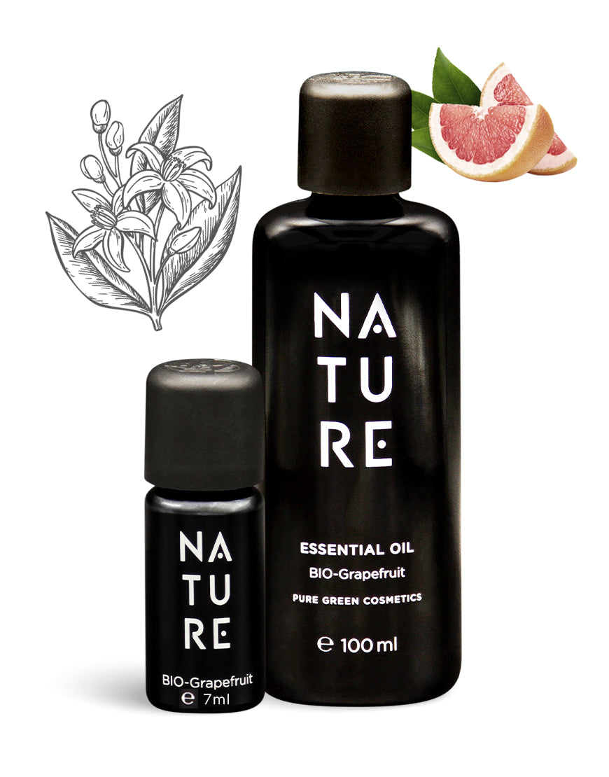 Zwei schwarze Flaschen NATURE BIO-Grapefruit-Öl, 7 ml und 100 ml, umgeben von Grapefruitscheiben. Ideal für stimmungsaufhellende, energetisierende Aromatherapie. Bio und vegan.