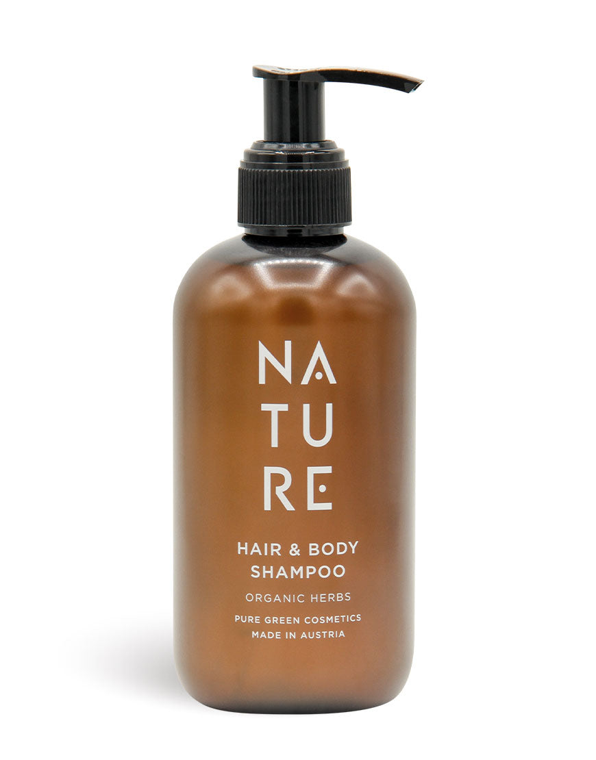 Amberfarbene Flasche mit schwarzem Spender, NATURE Hair-&-Body-Shampoo mit Apfelsaft & pflanzlichem Glycerin; Bio & Vegan, für sanfte Reinigung und seidig gepflegtes Haar.